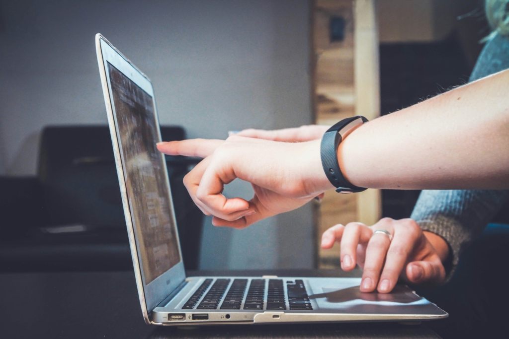 person checking their credit score on a laptop